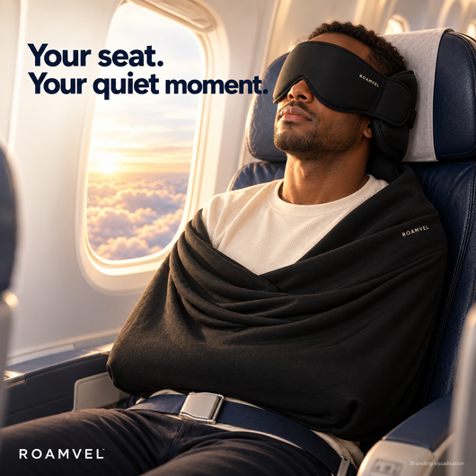Traveller wearing ROAMVEL sleep set in an airplane seat